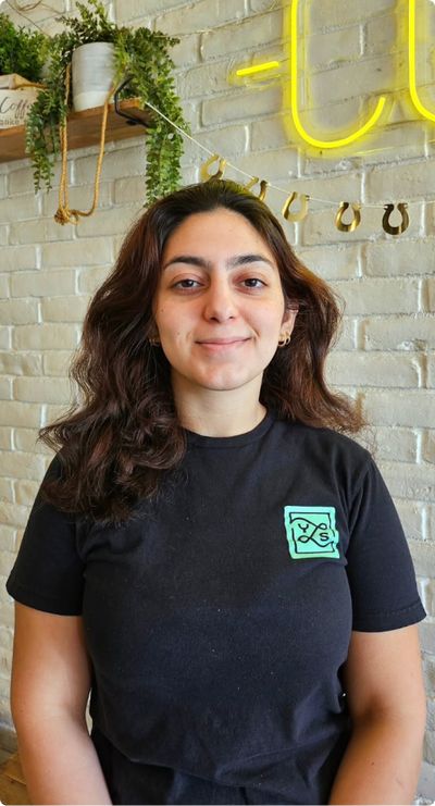YLS staff member posing for photo inside shop